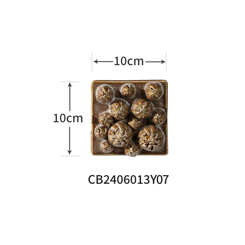Modern white bud ceramic wall décor pendant featuring a square textured brown planter with detailed cactus sculptures