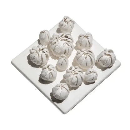 Modern white bud ceramic wall décor pendant featuring white ceramic dumplings on a square plate for bedroom décor pendant