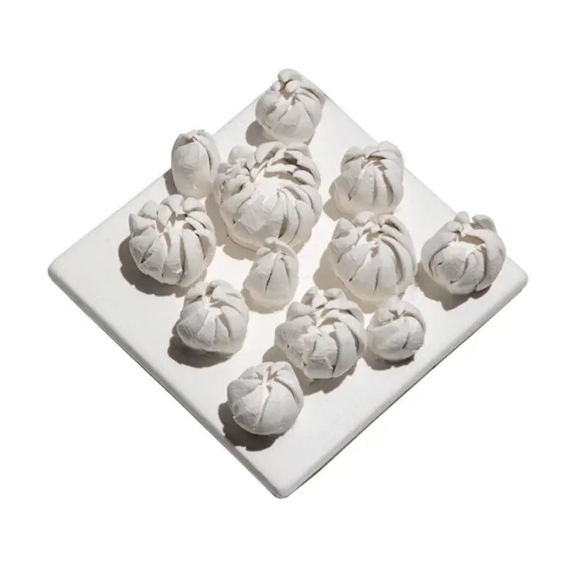 Modern white bud ceramic wall décor pendant featuring white ceramic dumplings on a square plate for bedroom décor pendant