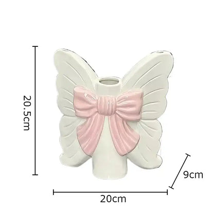 Modern white butterfly ceramic vase with pink bow featuring delicate design for bedroom decorbites butterfly ceramic use