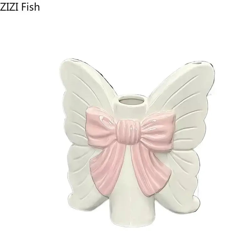 Modern white butterfly ceramic vase with pink bow by decorbites ideal for bedroom decor and ceramic vase flower display