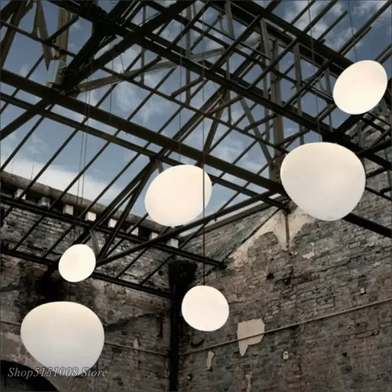 Modern white cascading glass pendant light featuring spherical glass pendant lights on a metal framework for dining room
