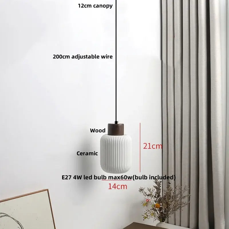 Modern white ceramic pendant light fixture with ribbed texture and dark wood top for kitchen decor