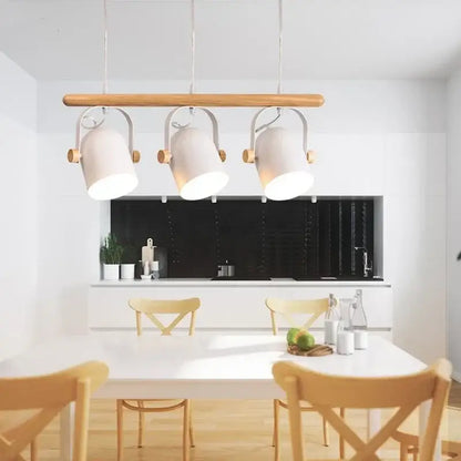 Modern white ceramic pendant lamp with wooden iron art accents hanging above a dining room table