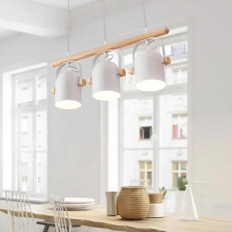 Modern white ceramic pendant lamp with wooden iron art accents hanging from a light wood beam for dining room