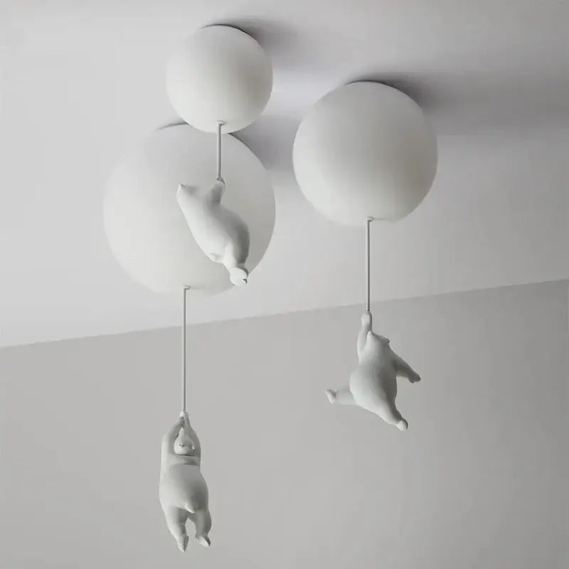 Modern white ceramic bear led ceiling light featuring polar bear figurines hanging from spherical fixtures for kids bedroom