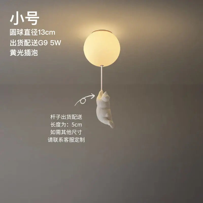 Modern white ceramic bear led ceiling light featuring a warm-toned spherical design with a playful cat figurine for kids bedroom