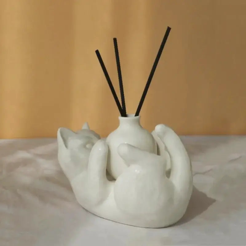 Modern white ceramic cat cartoon vase diffuser base shaped like two embracing cats with black reed sticks decorbites cat cartoon