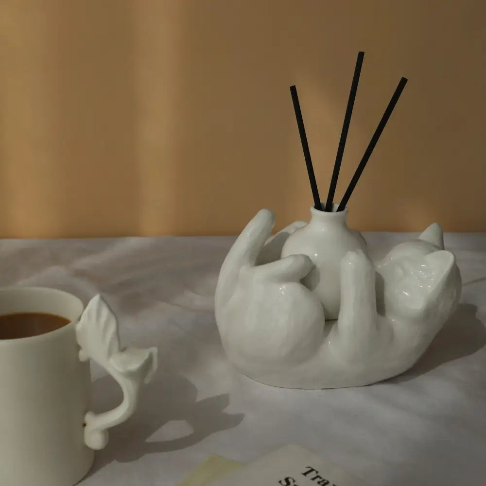 Modern white ceramic cat cartoon vase reed diffuser base with black reed sticks for living room decorbites cat cartoon