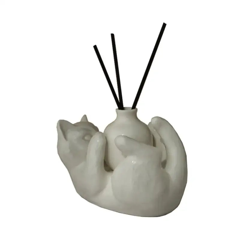 Modern white ceramic cat cartoon vase diffuser base shaped like two embracing cats with black reed sticks decorbites cat
