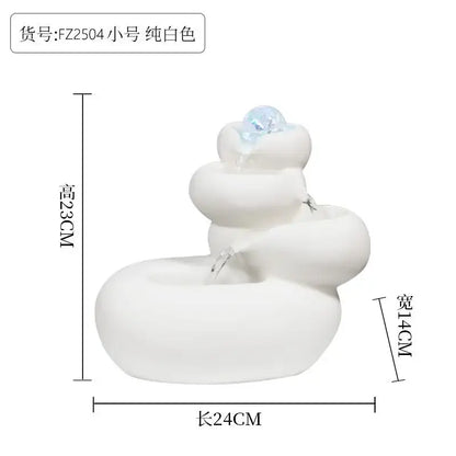 Modern white ceramic circulating water fountain with tiered rounded levels and clear crystal gem for living room decor