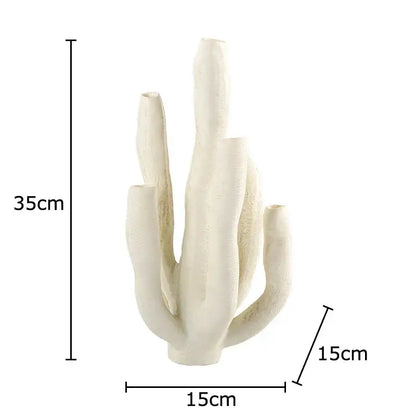 Modern white ceramic coral landscape sculpture with cream-colored textured vase and multiple slender openings decorbites coral