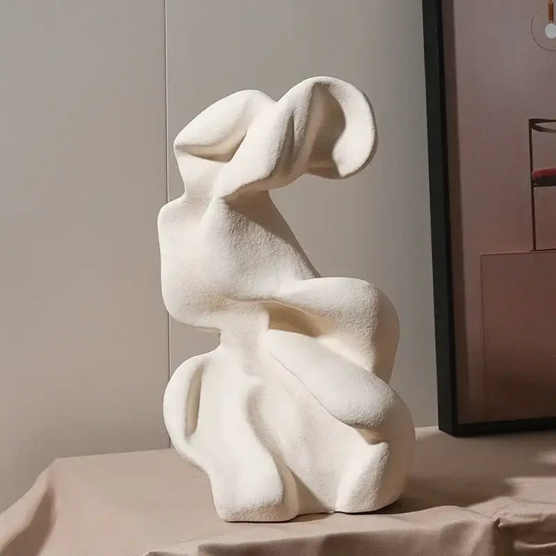 Cream-colored textured ceramic curl sculpture with flowing abstract form for modern curl sculpture decor