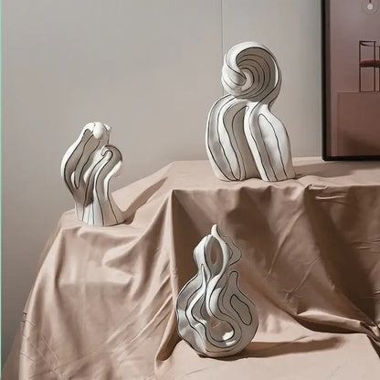Modern white ceramic curl sculpture with flowing wave forms and black linear detailing for living room decor