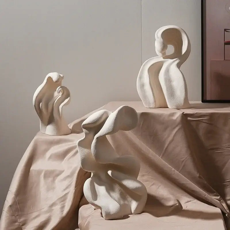 Modern white ceramic curl sculpture featuring three abstract off-white curl sculpture decor pieces for living room