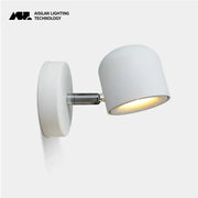 Modern white ceramic dimmable led wall lamp with sleek adjustable arm and metallic joint for bedroom reading light decorbites wall lamp
