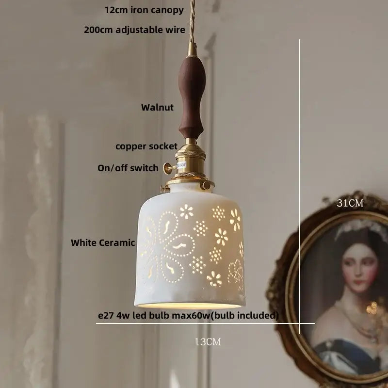 Modern white ceramic flower pendant lamp with floral cutouts, walnut handle, and brass accents for kitchen led lighting