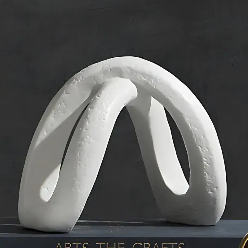 Modern white ceramic infinity symbol vase with smooth flowing curves and subtle texture for decorbites infinity decor