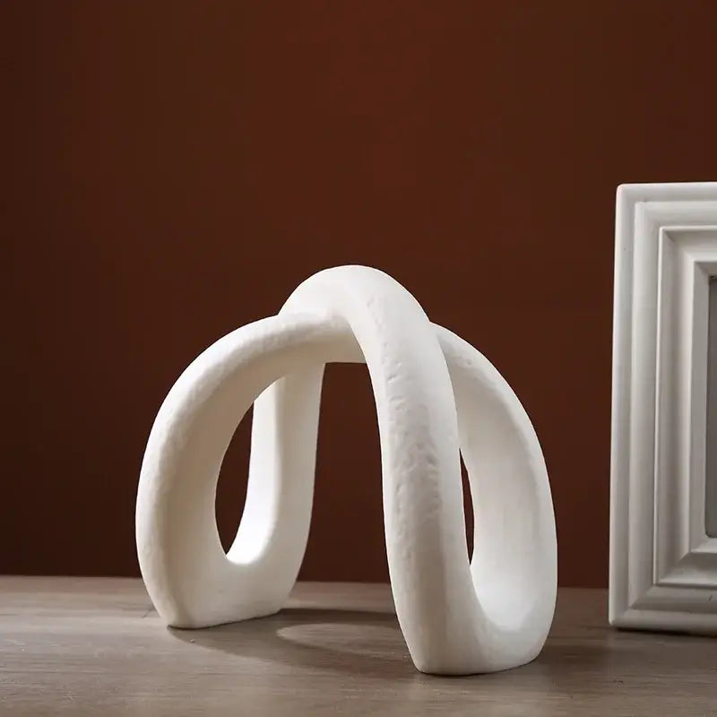 Modern white ceramic infinity symbol sculpture with smooth curves for decorbites infinity symbol living room decor