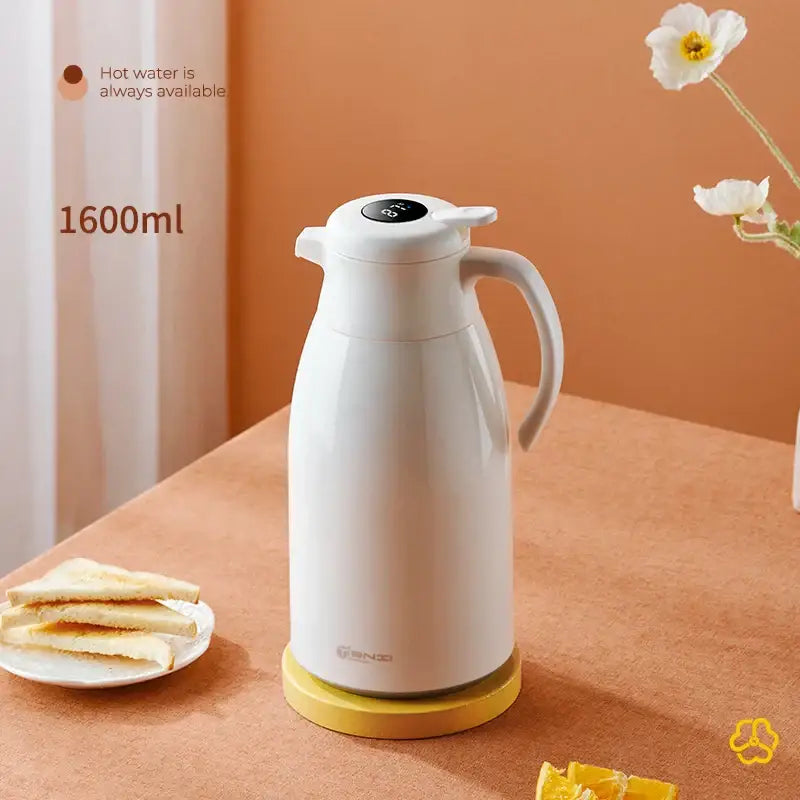 Modern white ceramic decorbites insulation kettle with digital display ergonomic handle on yellow base