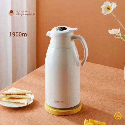 Modern white ceramic decorbites insulation kettle with digital temperature display and ergonomic handle on yellow base