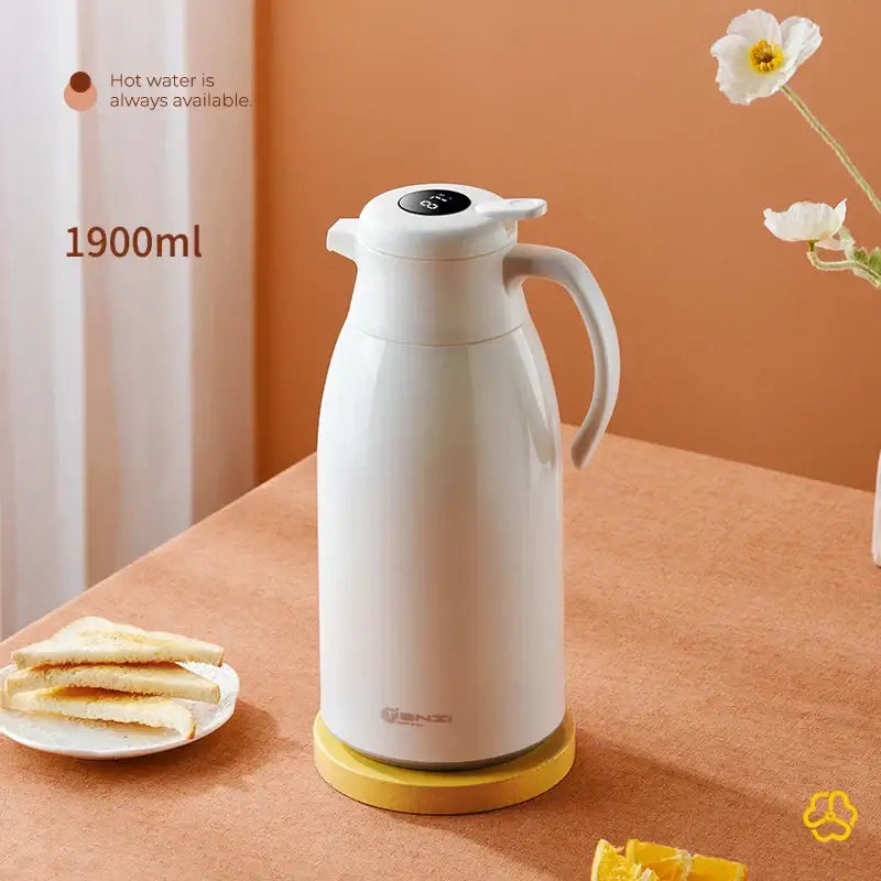 Modern white ceramic decorbites insulation kettle with digital temperature display and ergonomic handle on yellow base