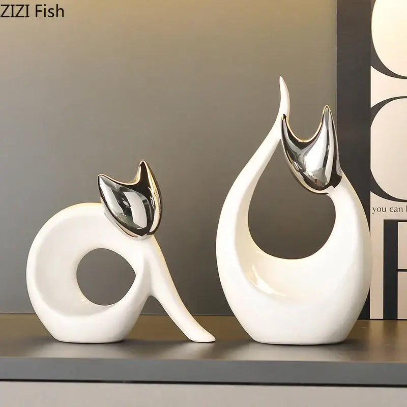 Modern white ceramic kitten statue with sleek design and shiny silver metallic ears for living room decor