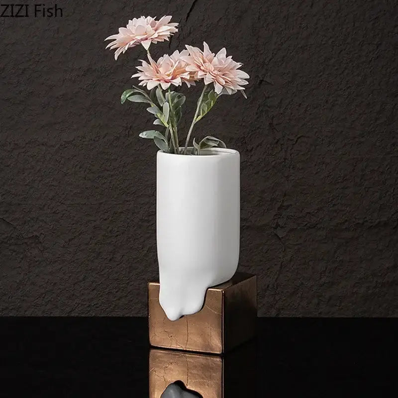 Modern white ceramic liquid vase with unique dripping design on bronze square base for stylish living room decorbites ceramic liquid decor