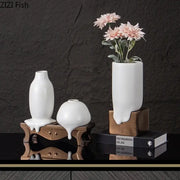 Modern white ceramic liquid vase with melting design and metallic bronze bases for living room decorbites ceramic decor