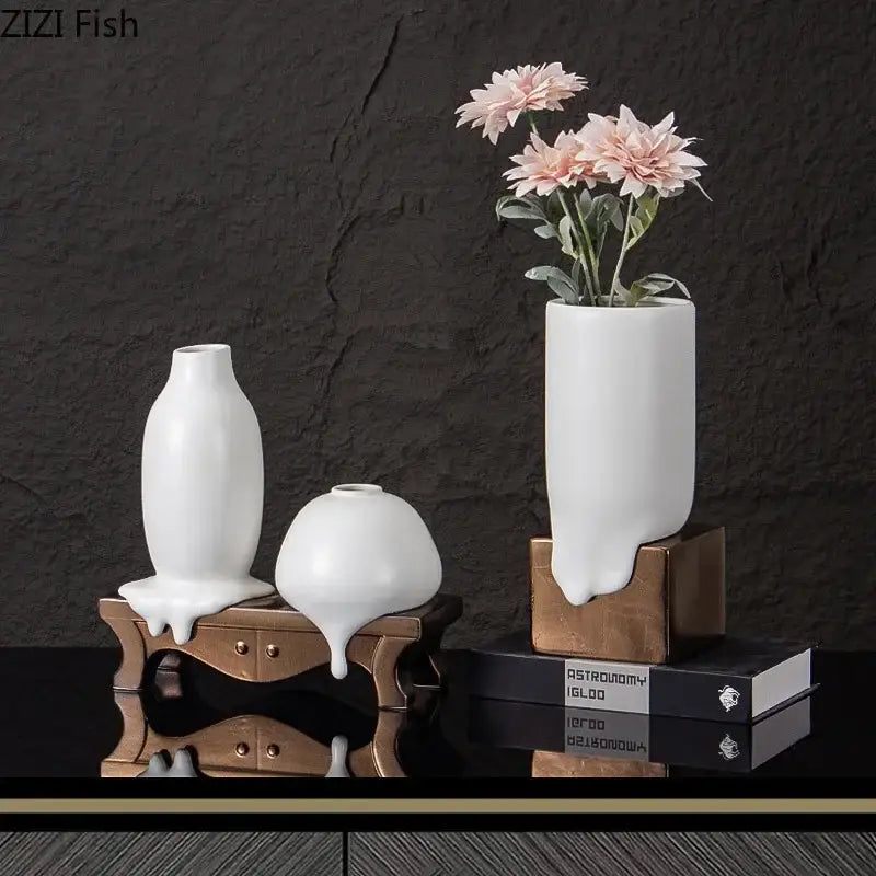 Modern white ceramic liquid vase with melting design and metallic bronze bases for living room decorbites ceramic decor