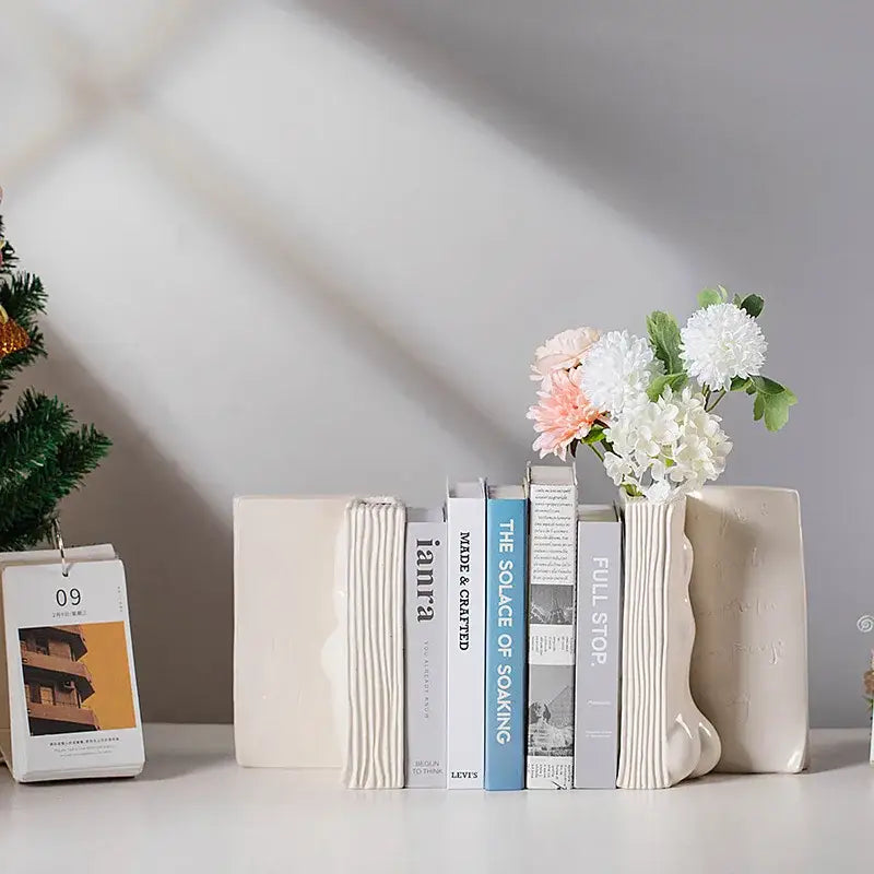Cream-colored decorbites ceramic man face bookends with ribbed texture hold artificial flowers for living room decor storage