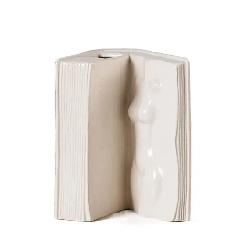 Modern white ceramic man face book vase with cream-colored open book shape and sculpted female figure for living room decorbites ceramic man face decor