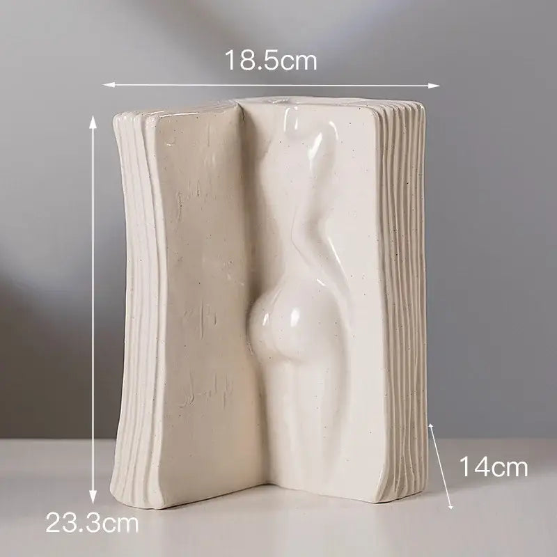 Modern cream-colored ceramic man face vase shaped like an open book with sculpted female figure for living room decorbites ceramic man decor