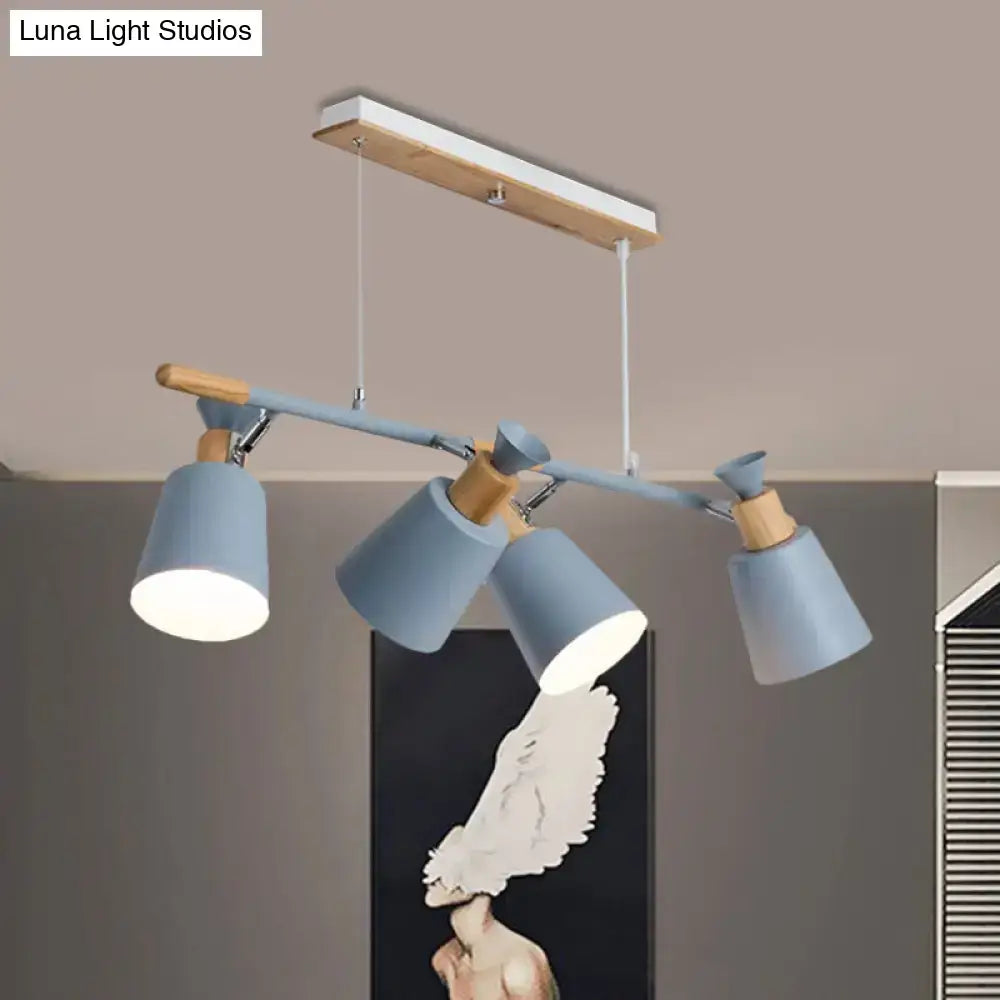 Modern blue and wood-toned island light with tapered shade and adjustable spotlight heads featuring bulb base design