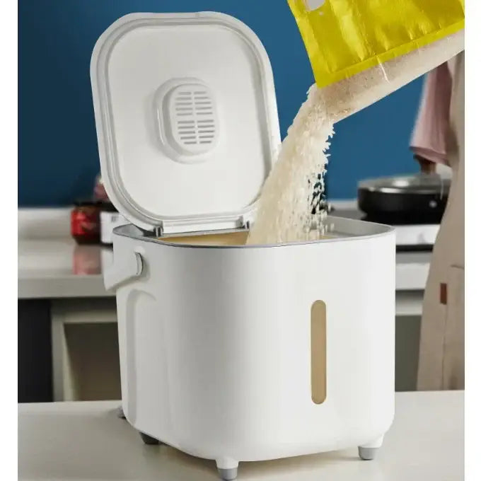 Modern white ceramic food storage container for rice with hinged lid and vertical handle for kitchen use