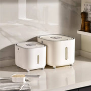 Modern white ceramic food storage container with sleek silver lids and transparent windows for rice and grains storage