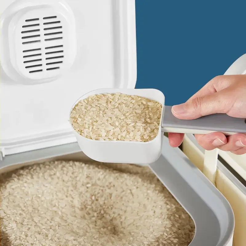 White plastic rice scoop with gray handle filled with brown rice inside modern white ceramic food storage container
