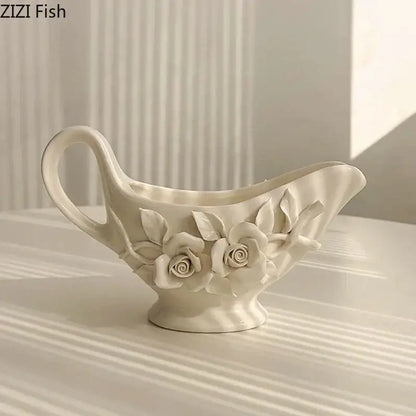 A delicate white ceramic tissue box featuring raised camellia flower motifs for living room use