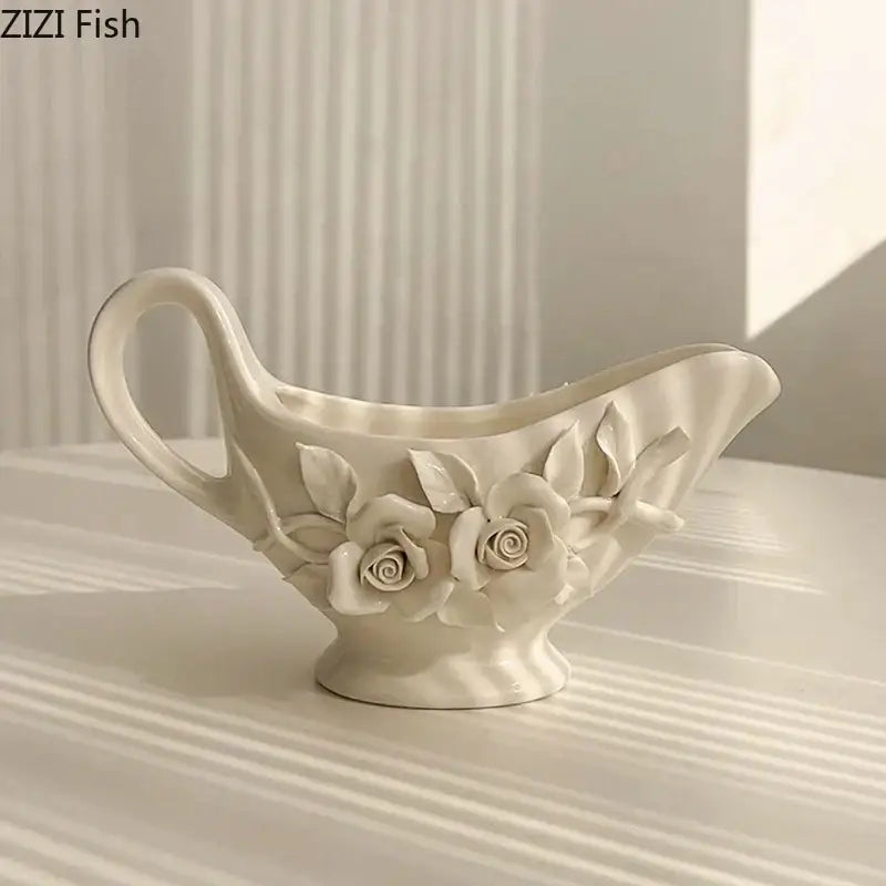 A delicate white ceramic tissue box featuring raised camellia flower motifs for living room use