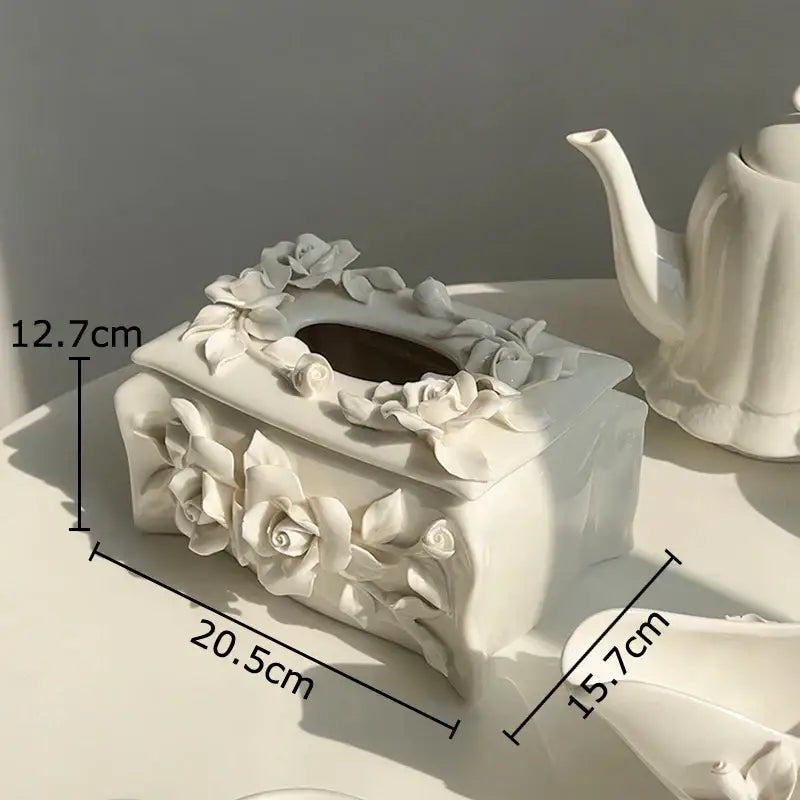 Modern white ceramic tissue box with sculpted camellia flower details for living room decor
