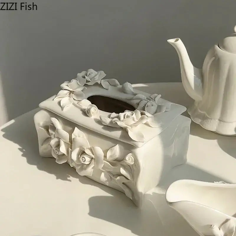 Modern white ceramic tissue box featuring intricate three-dimensional camellia flower sculptures for living room use