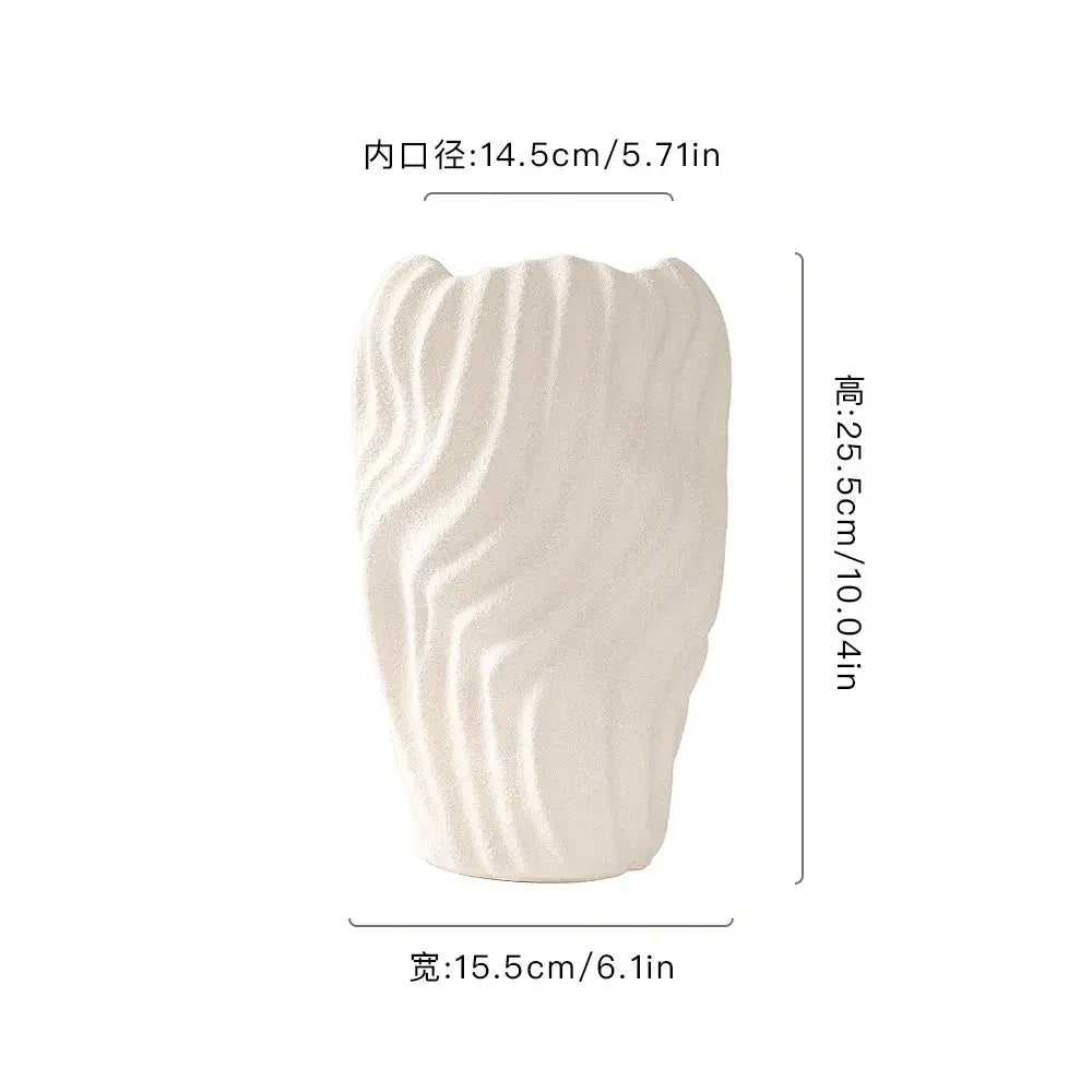 Modern white ceramic vase with irregular wavy patterns and textured surface for living room decor
