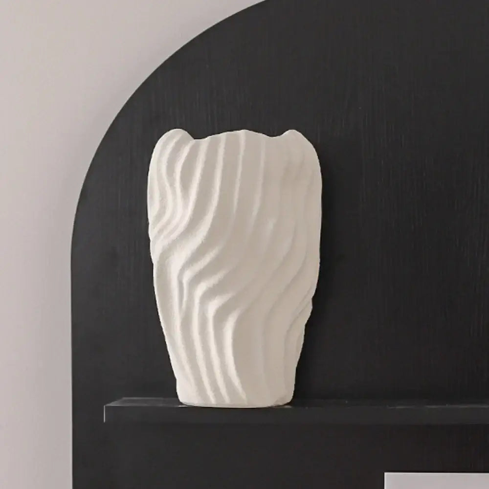 Modern white ceramic vase with irregular wavy patterns and sculpted texture for living room decor