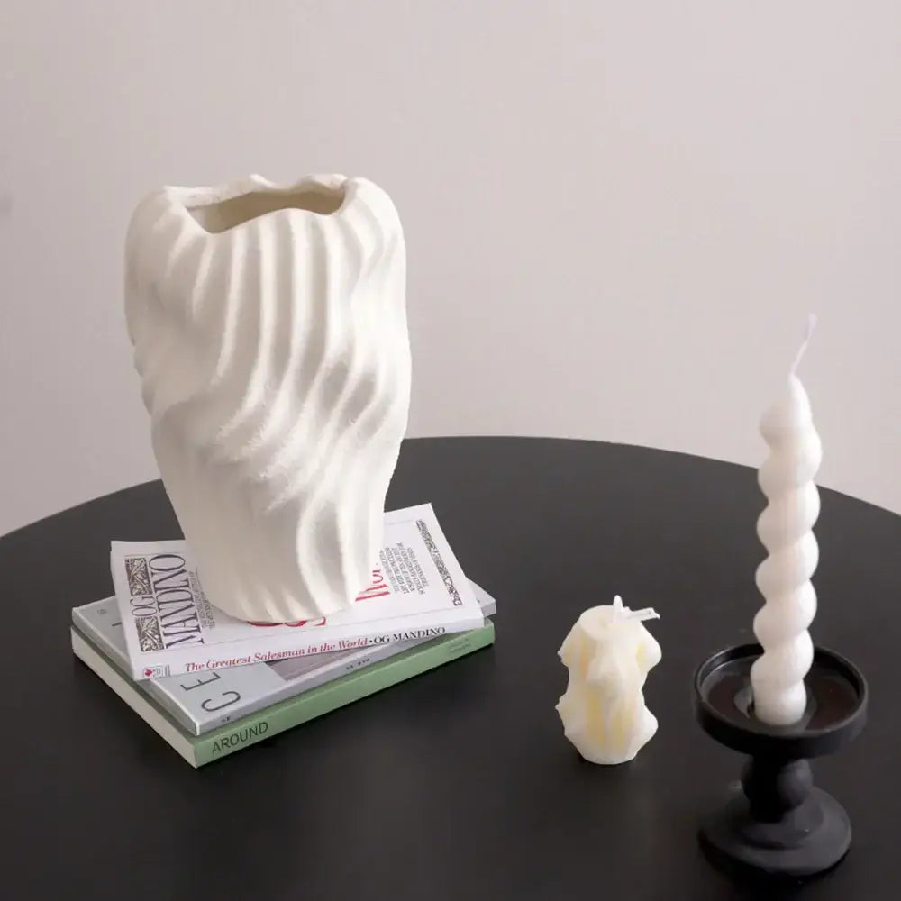 Modern white ceramic vase with vertical ridges and irregular wavy patterns for stylish living room decor