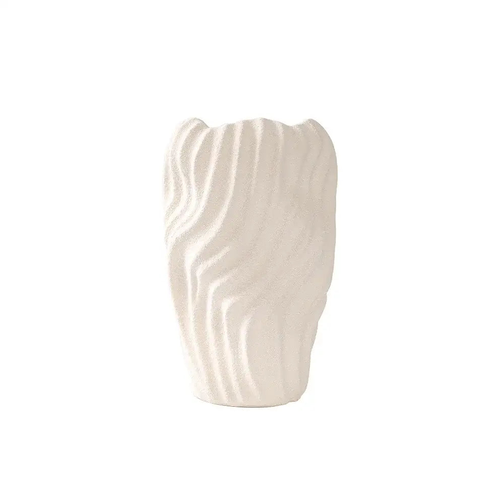 A sleek white ceramic vase with irregular wavy patterns and flowing vertical ridges perfect for living room decor