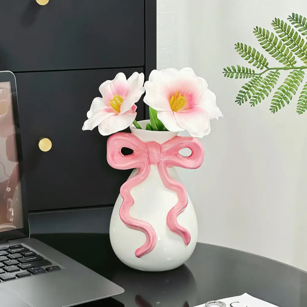 Modern white ceramic vase with pink cute bow design holding two artificial flowers for living room decorbites 3d ribbon decor