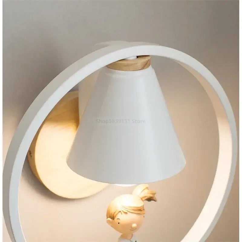 Modern white child figurine led wall lamps featuring a white conical lampshade with wooden base and minimalist frame