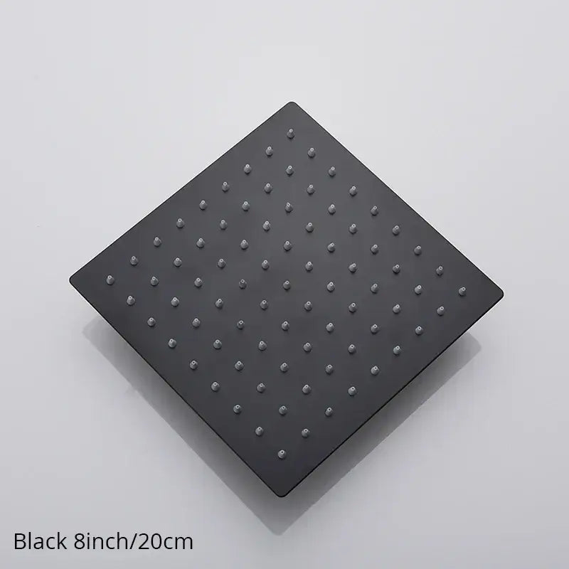 Modern black matte rainfall shower head with evenly spaced metallic nozzles for a sleek bathroom fixture