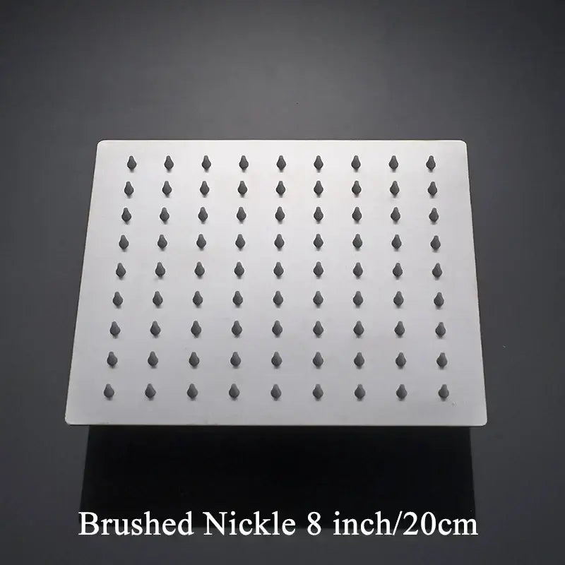 Brushed nickel square rainfall shower head with dark gray nozzles for modern white chrome bathroom fixture