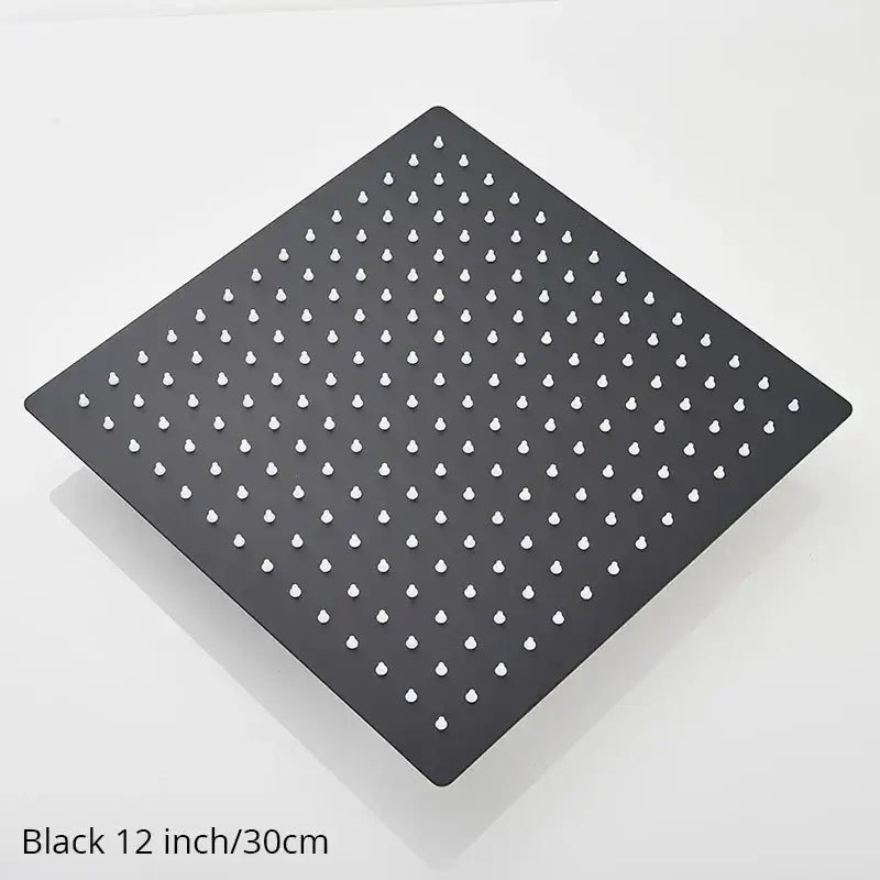 Black 12-inch square rainfall shower head with matte finish and white nozzles for modern bathroom fixtures